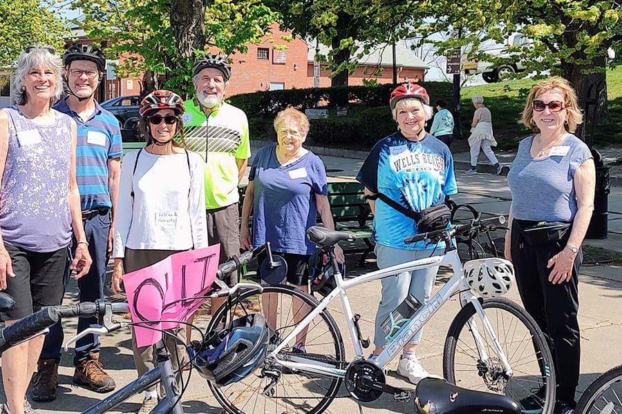 OLLI participants pose with bikes.