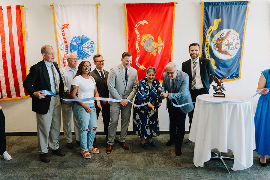 Campus leaders and students cut the ribbon on a new Student Veteran Center.