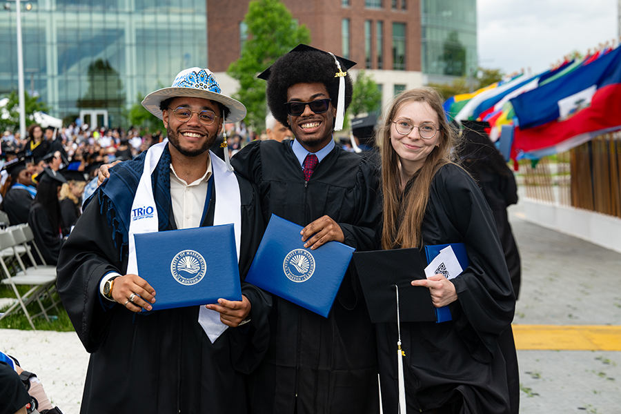 Three students pose together at 2026 Commencement