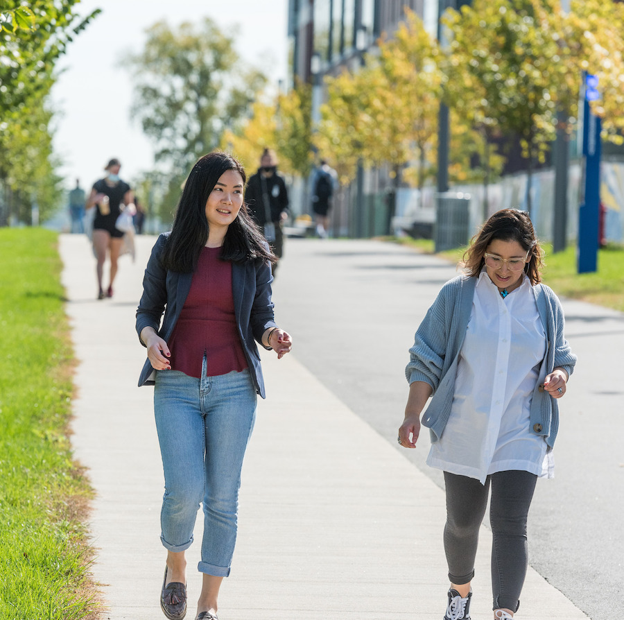 Students walking campus greenway