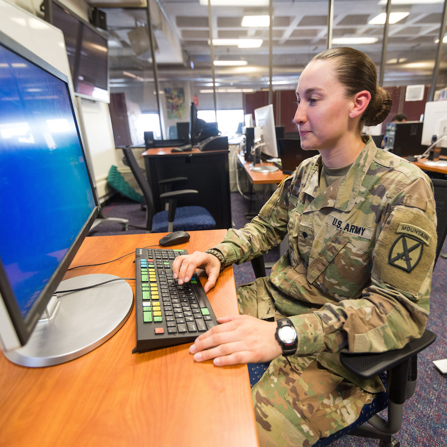 Veteran student at computer in uniform