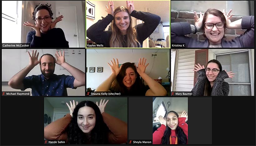 Lab members do an axolotl pose during a zoom lab meeting.