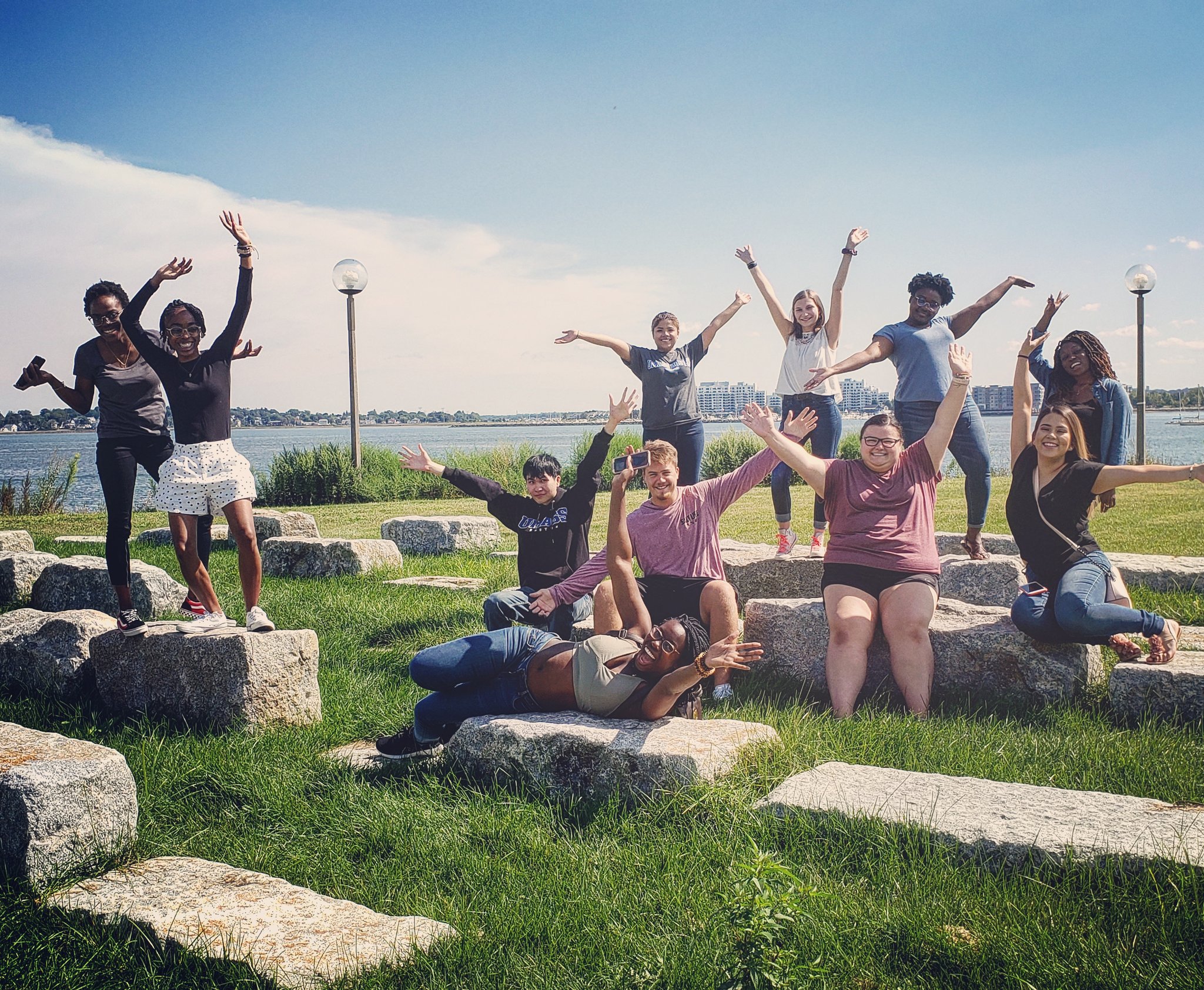 Excited students on UMass Boston front lawn