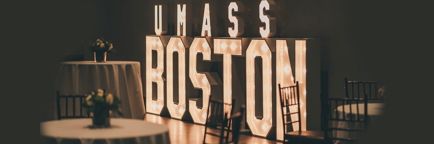 indoor sign of UMass Boston lit up
