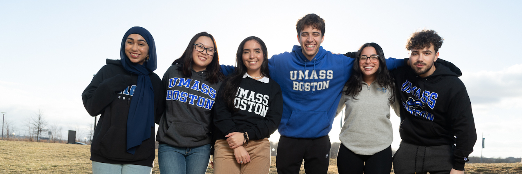 UMass Boston students wearing college gear