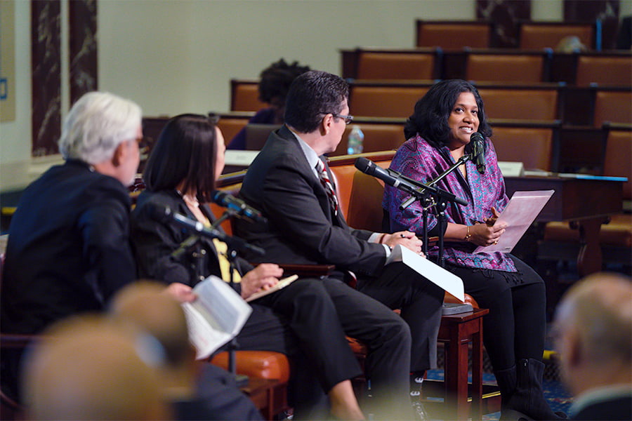 People at microphone at a  Pathways to Higher Education event.