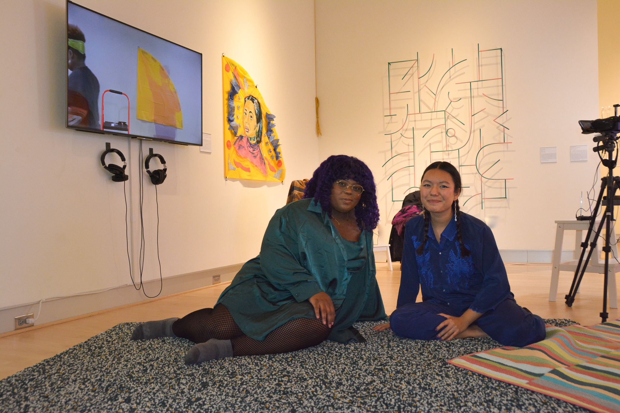 Artists Chanel Thervil and Mel Taing in the University Hall Gallery.  