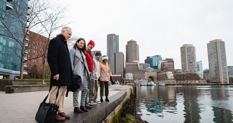 Paul Kirshen and associates look out on the Boston Harbor 