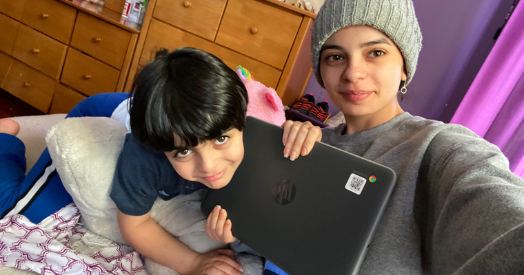 Chromebook recipient Suzanne Alkhatatbih and her younger brother 