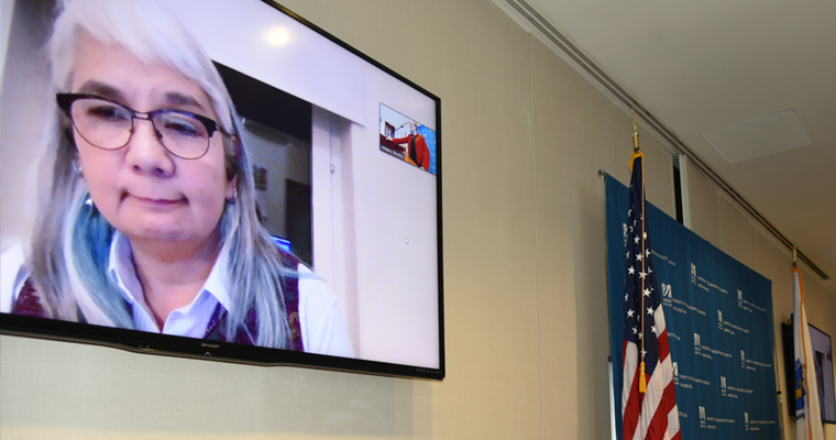 Karen Suyemoto spoke to the crowd from Sweden