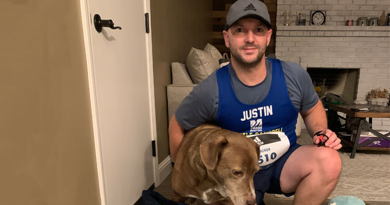 Justin Gagnon sitting in his home before running a virtual marathon