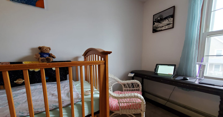 A home office set up in a baby's nursery room. 