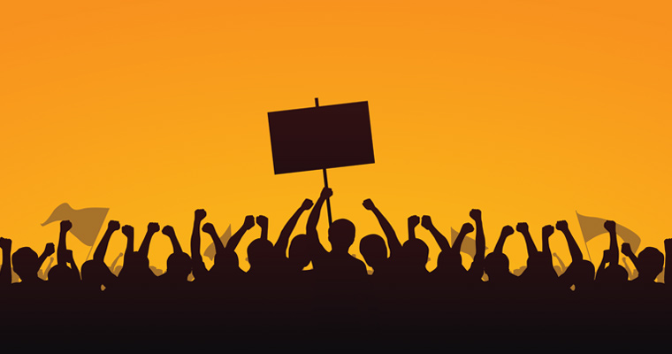 Illustration of workers holding up protest signs at a rally 