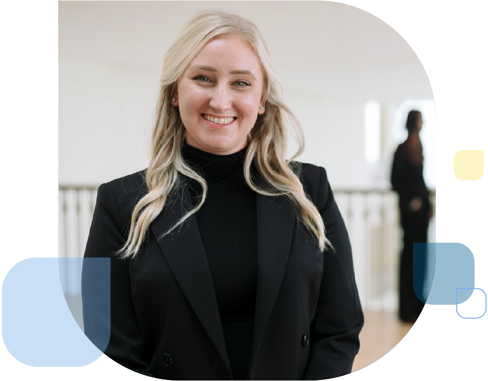 Accounting student wearing black suit and turtleneck.