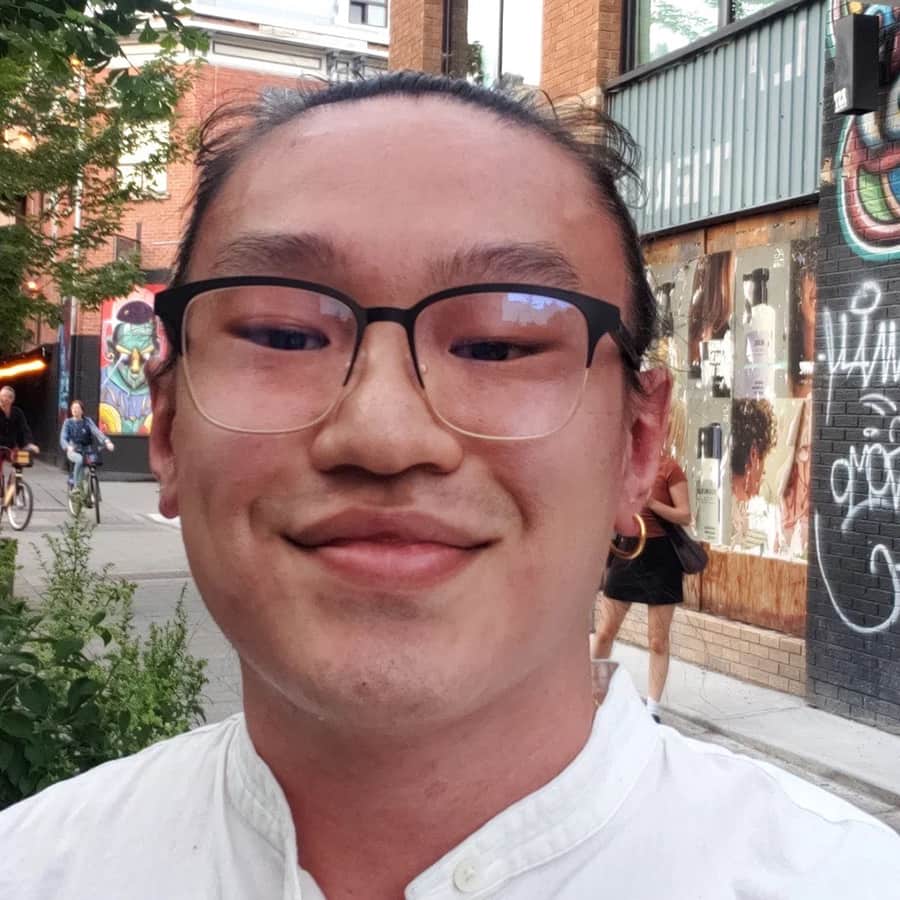 Headshot of student, Phillip, smiling.