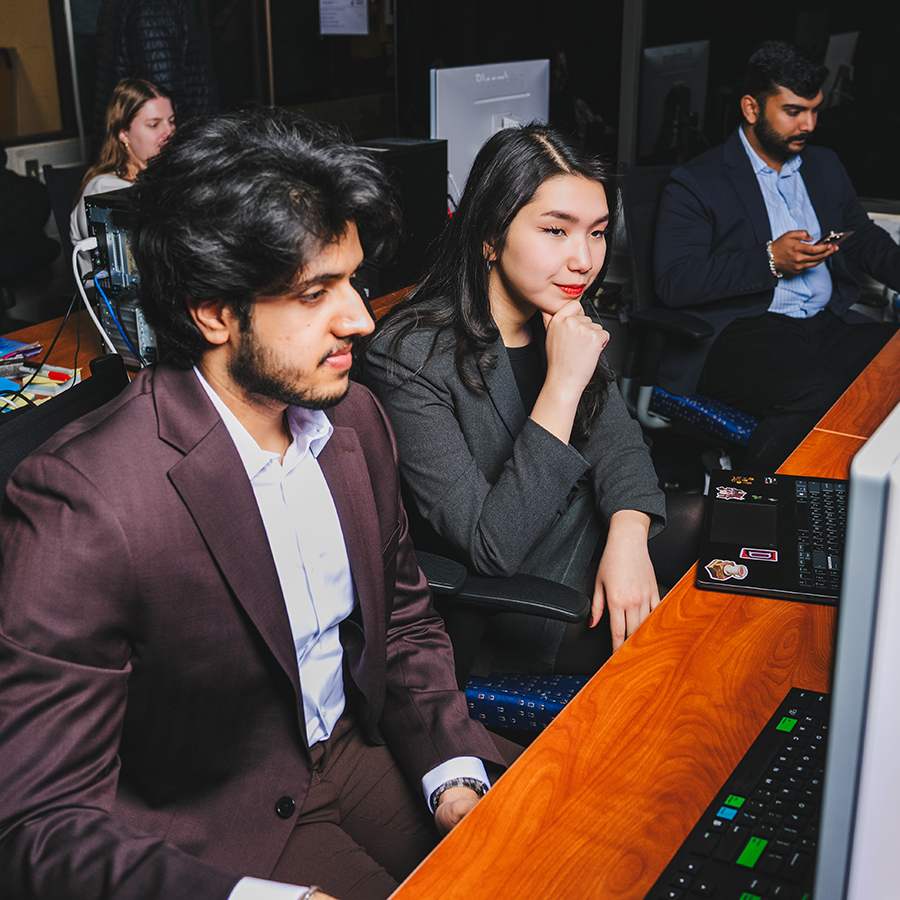 Business student reviewing data on computer.