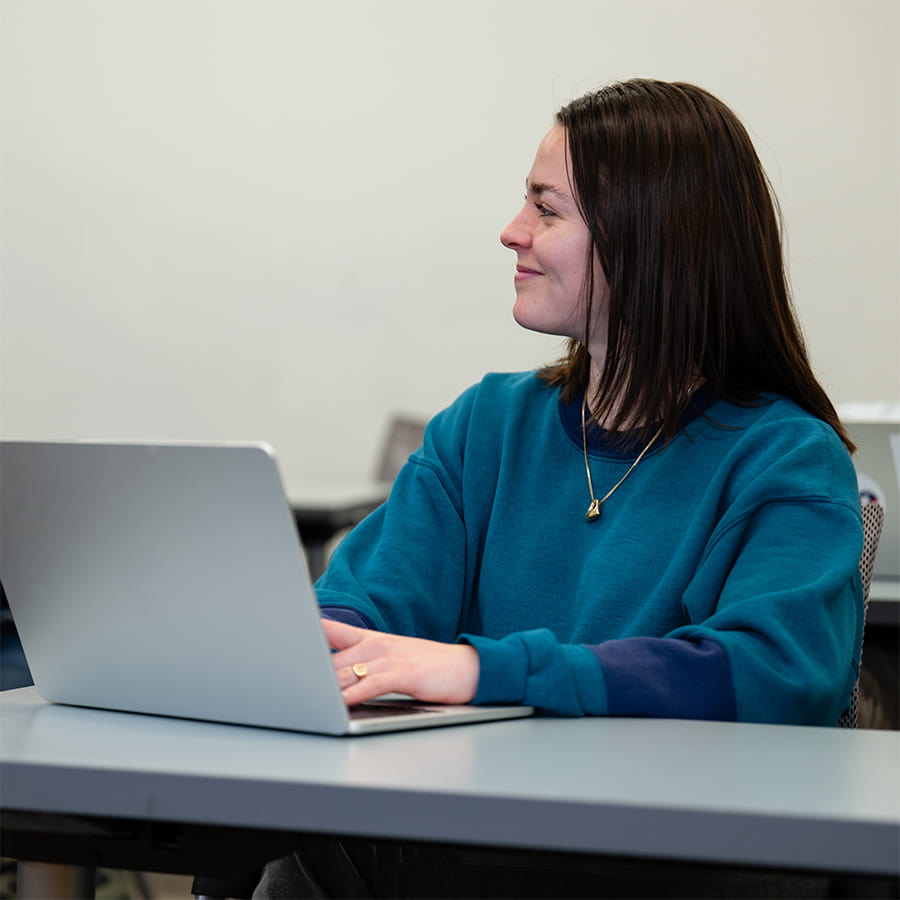 Student working on laptop.