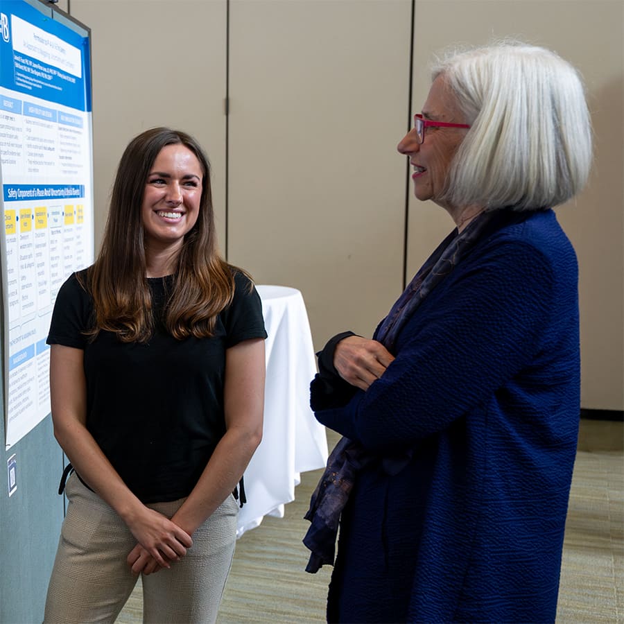 Graduate Student presenting to a teacher.