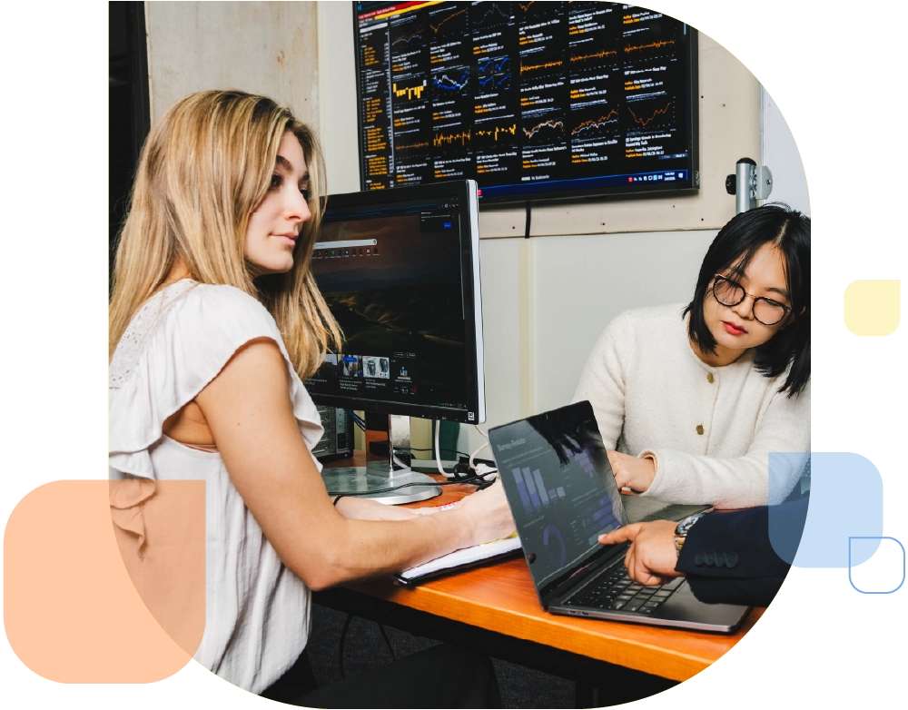 College of Management students working together in the Bloomberg Room.