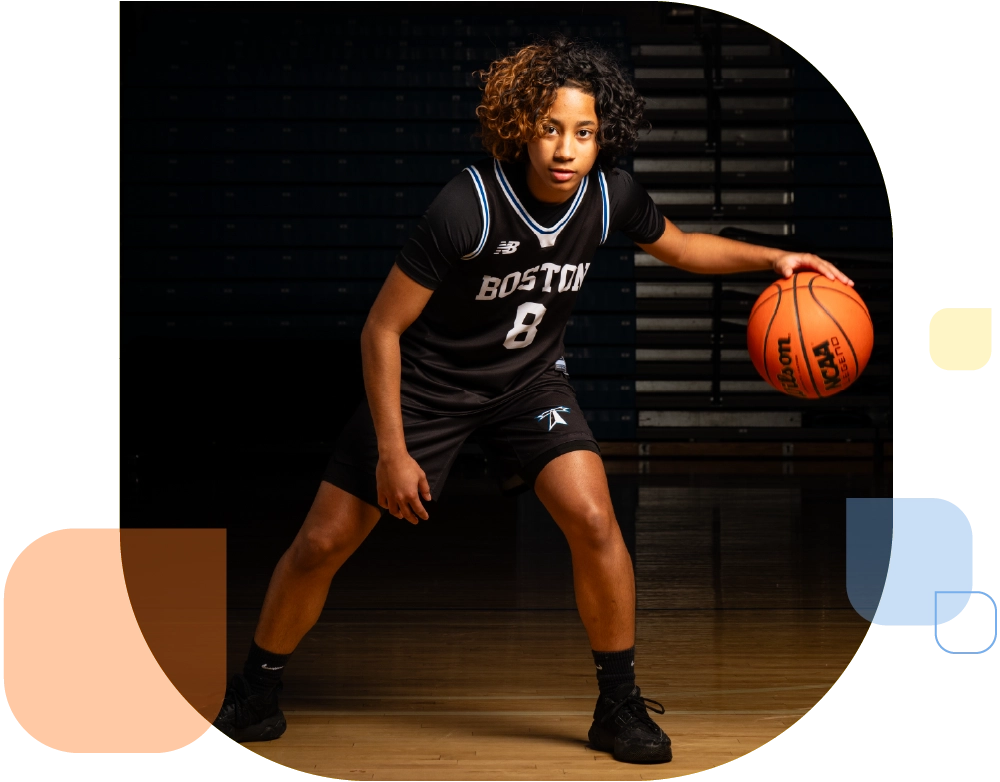 female basketball athlete mid bounce of basketball