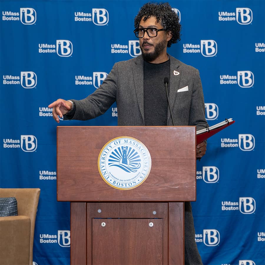 Imari Paris Jeffries, PHD giving keynote speech at podium.