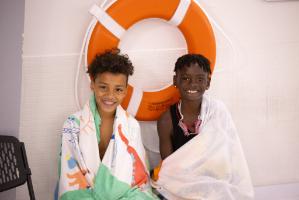 Campers Smiling in Pool