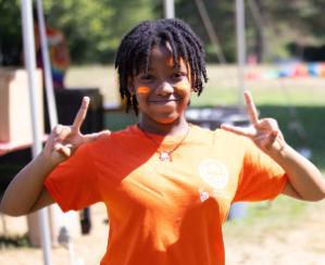 Camper Giving PEace Sign
