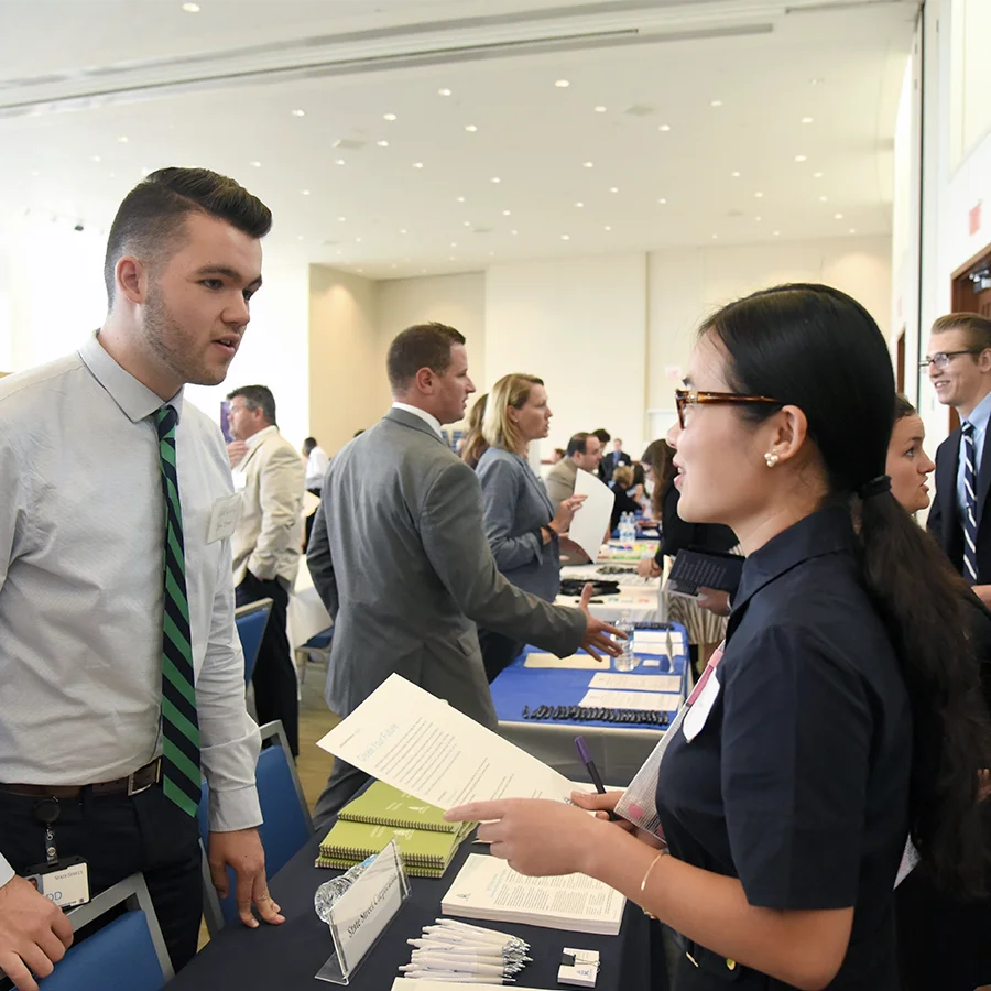 Students at a business focussed career fair at UMass Boston.