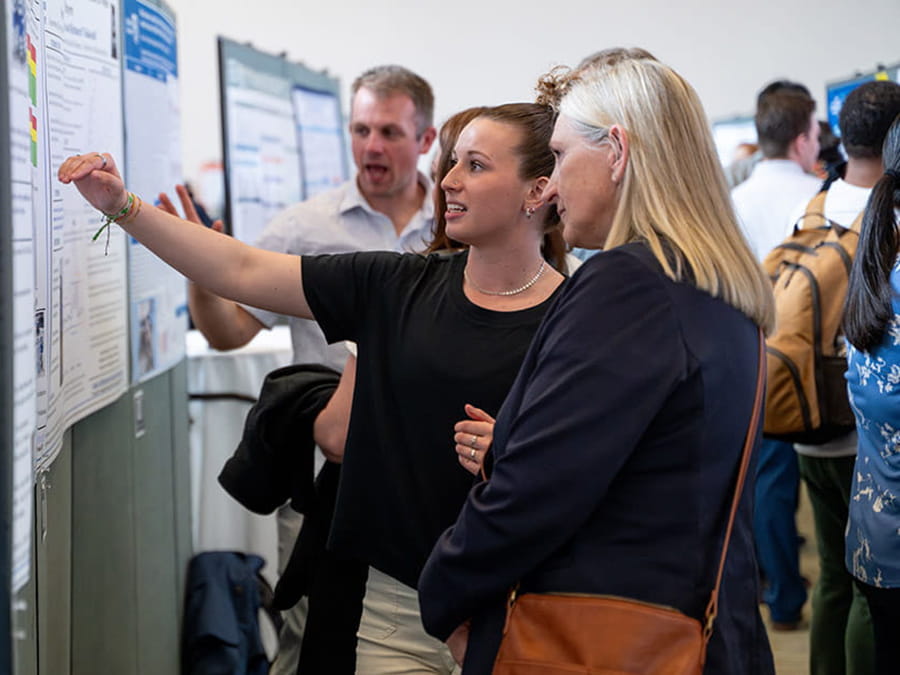 Student showcasing their research at Research Day.