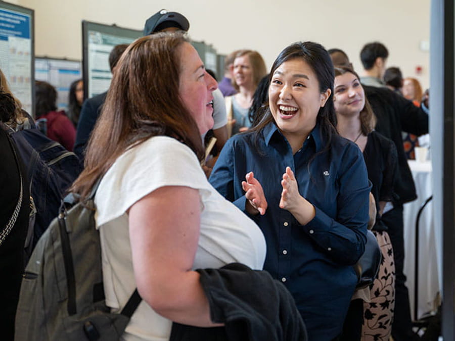 Students talking about research at Research Day.