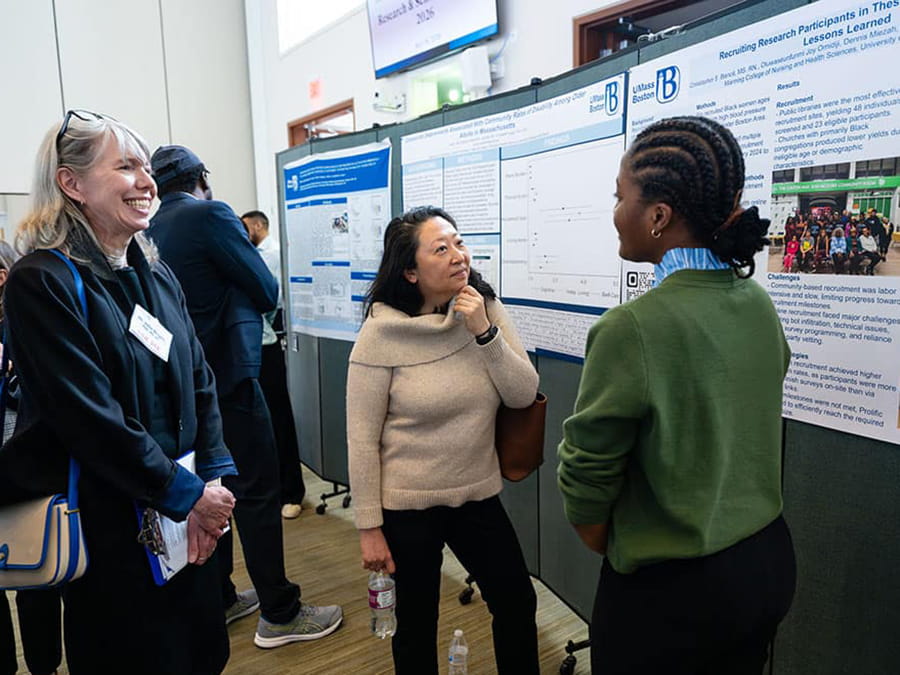 Student showcasing their research at Research Day.