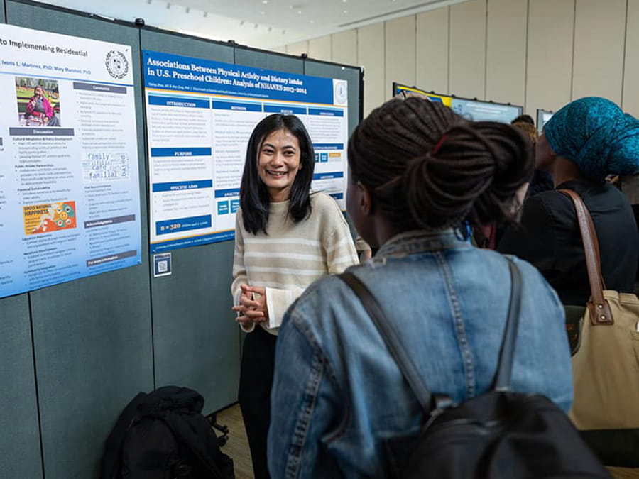 Student showcasing their research at Research Day.