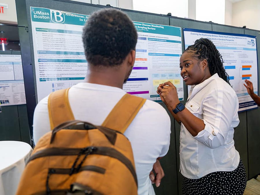 Student showcasing their research at Research Day.