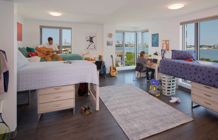 students studying in their residence hall room