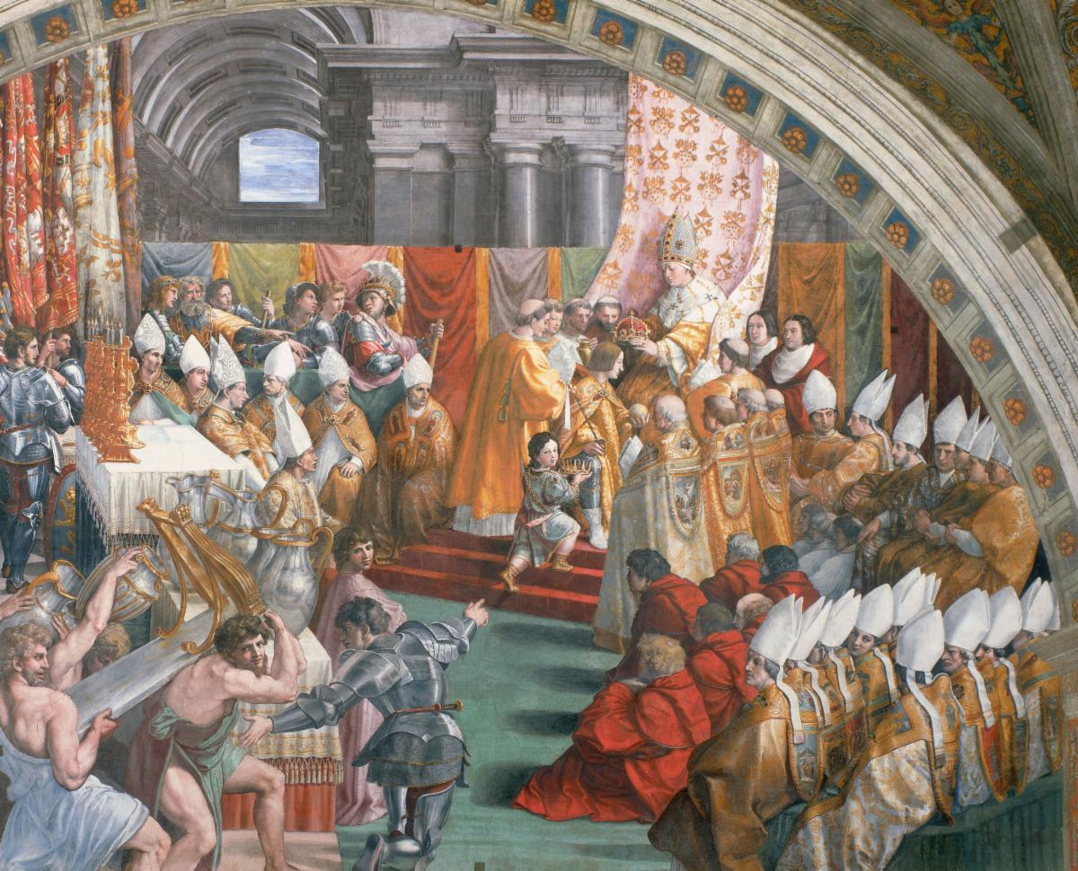 A crowd of people surrounding a pope
