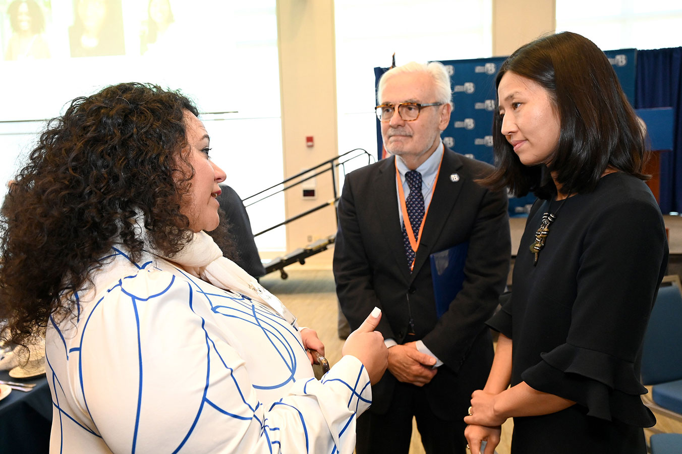 Chancellor Suarez-Orozco and Mayor Wu speak to Suha Ballout