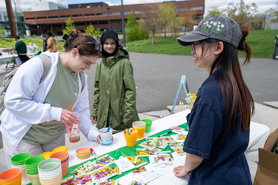 Students check out the tables at the Walk with Grace event