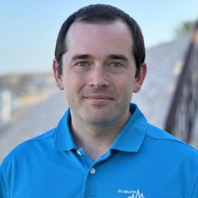 Man with short brown hair, blue shirt